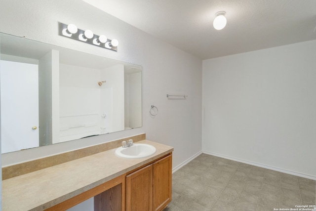 9423 Maraval Crk, San Antonio, TX 78245 - full bathroom featuring vanity, tile patterned floors, baseboards, and a shower