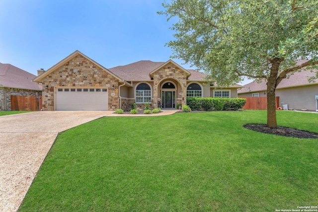 1216 Windy Dawn, Seguin, TX 78155 - view of front of house featuring stone siding, an attached garage, and driveway
