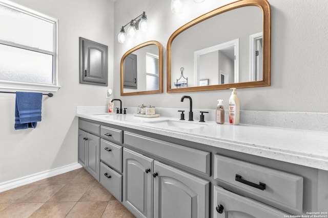 1216 Windy Dawn, Seguin, TX 78155 - full bathroom with double vanity, tile patterned flooring, and baseboards