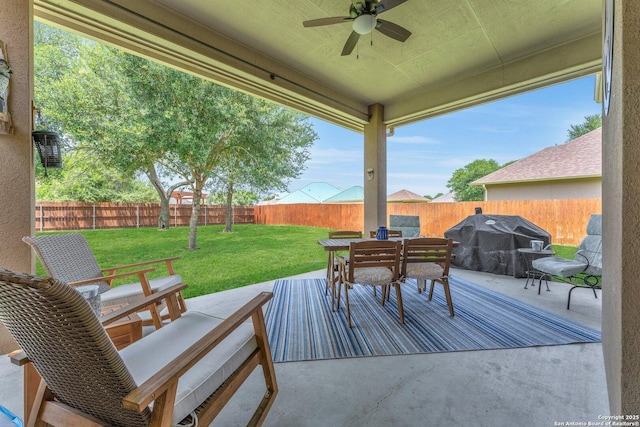 1216 Windy Dawn, Seguin, TX 78155 - wooden terrace with a ceiling fan, outdoor dining space, a grill, and a patio