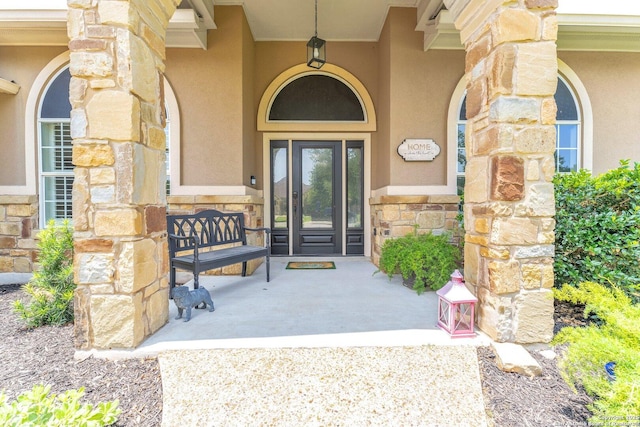 1216 Windy Dawn, Seguin, TX 78155 - property entrance featuring stone siding, stucco siding, and a porch