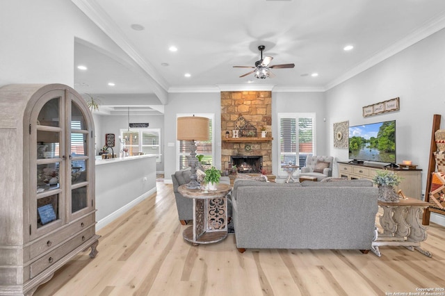 1216 Windy Dawn, Seguin, TX 78155 - living area with light wood-type flooring, a ceiling fan, recessed lighting, a fireplace, and crown molding