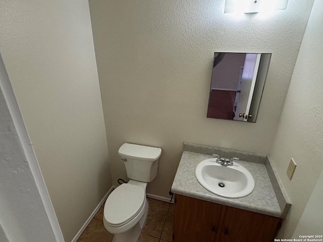 7835 Ruby Mdw, San Antonio, TX 78251 - bathroom with vanity, tile patterned floors, and toilet
