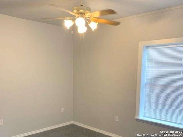 2313 Fresno, San Antonio, TX 78201 - empty room featuring a ceiling fan, baseboards, and dark colored carpet
