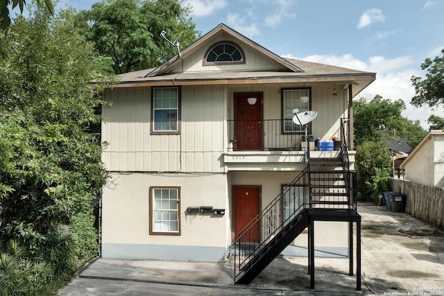 2313 Fresno, San Antonio, TX 78201 - view of front of home featuring stairway, a porch, and stucco siding