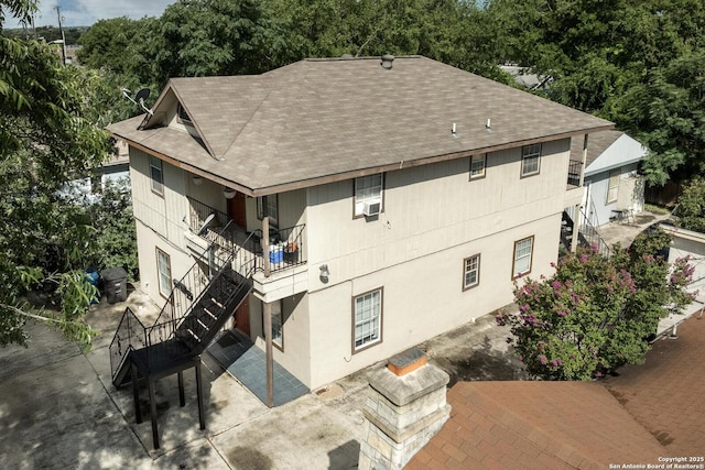 2313 Fresno, San Antonio, TX 78201 - view of property with stairway and view of wooded area