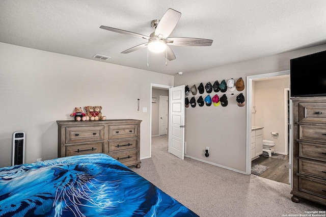 7129 Pisces, Converse, TX 78109 - bedroom featuring ensuite bath, carpet floors, a ceiling fan, baseboards, and a textured ceiling