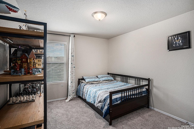 7129 Pisces, Converse, TX 78109 - bedroom featuring carpet floors, a textured ceiling, baseboards, and a textured wall
