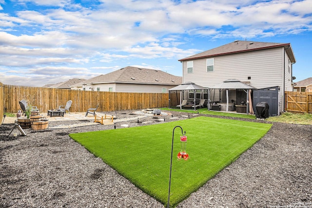 7129 Pisces, Converse, TX 78109 - rear view of property featuring a gazebo, a fire pit, a patio area, and a fenced backyard