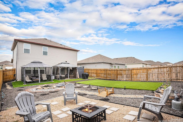 7129 Pisces, Converse, TX 78109 - back of property with a fire pit, a gazebo, and a patio area