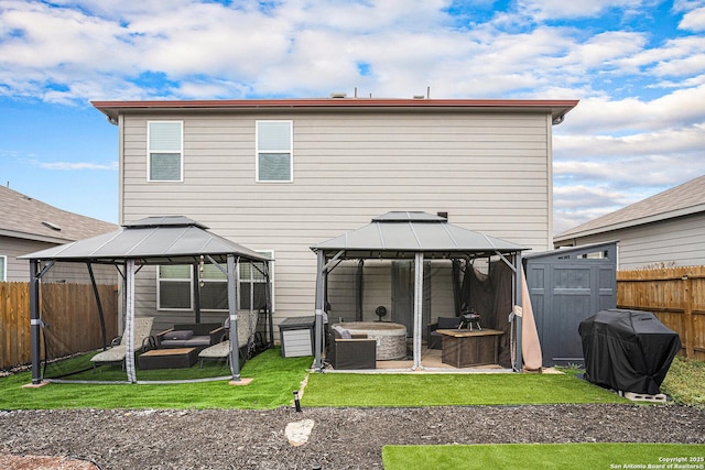 7129 Pisces, Converse, TX 78109 - back of house with a gazebo, outdoor lounge area, and a fenced backyard
