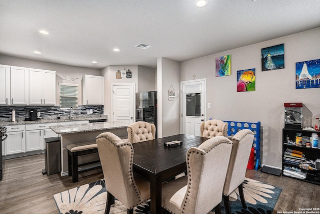 7129 Pisces, Converse, TX 78109 - dining room with dark wood-style floors, recessed lighting, and baseboards