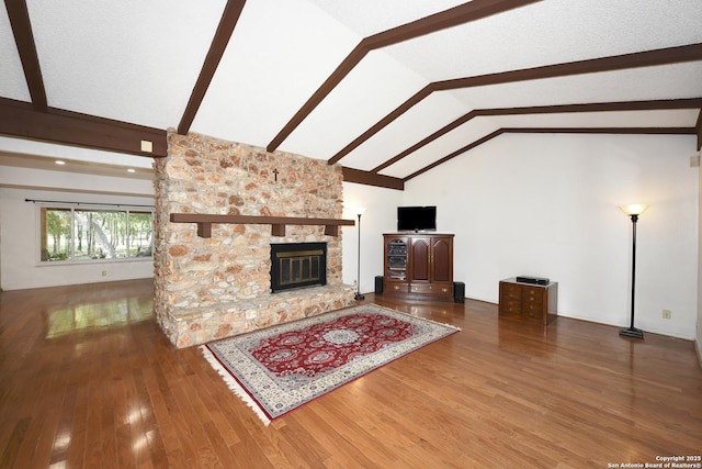 5803 Hollyhock, San Antonio, TX 78240 - unfurnished living room featuring wood finished floors, a fireplace, beam ceiling, and high vaulted ceiling