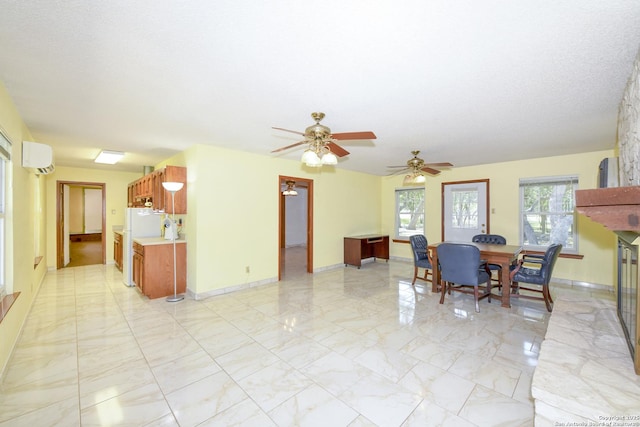5803 Hollyhock, San Antonio, TX 78240 - dining space with light marble finish flooring, an AC wall unit, ceiling fan, and baseboards