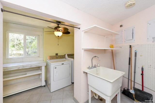 5803 Hollyhock, San Antonio, TX 78240 - laundry area with independent washer and dryer, a ceiling fan, light tile patterned floors, a textured ceiling, and electric panel