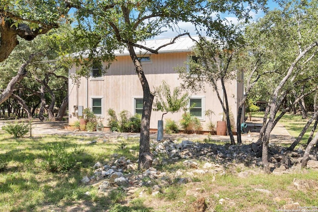5803 Hollyhock, San Antonio, TX 78240 - view of side of home featuring metal roof