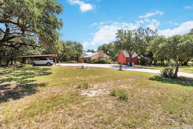 5803 Hollyhock, San Antonio, TX 78240 - view of grassy yard featuring curved driveway