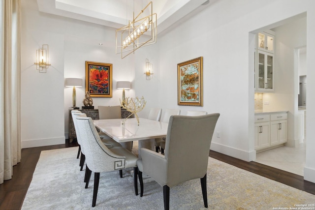 23510 Avila, San Antonio, TX 78255 - dining room with wood finished floors, baseboards, and a tray ceiling