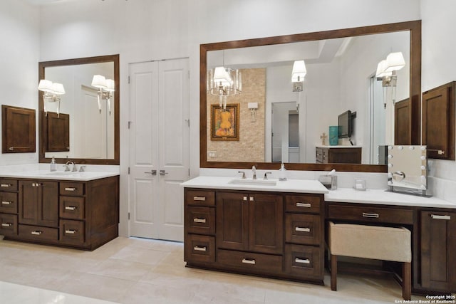 23510 Avila, San Antonio, TX 78255 - bathroom featuring two vanities, a chandelier, and tile patterned flooring