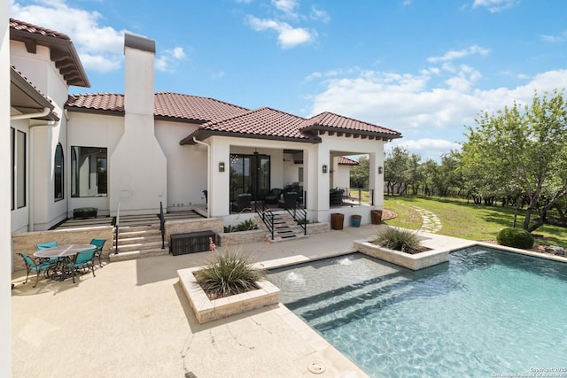 23510 Avila, San Antonio, TX 78255 - back of property featuring a patio, a tiled roof, stucco siding, an outdoor pool, and outdoor dining space