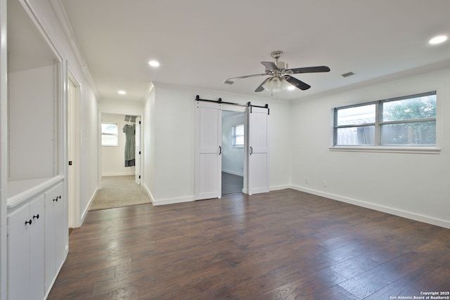 425 Winfield Blvd, San Antonio, TX 78239 - spare room featuring ceiling fan, crown molding, dark wood-type flooring, a barn door, and baseboards