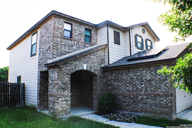 8815 Adhinger, San Antonio, TX 78245 - traditional-style home featuring roof mounted solar panels and brick siding