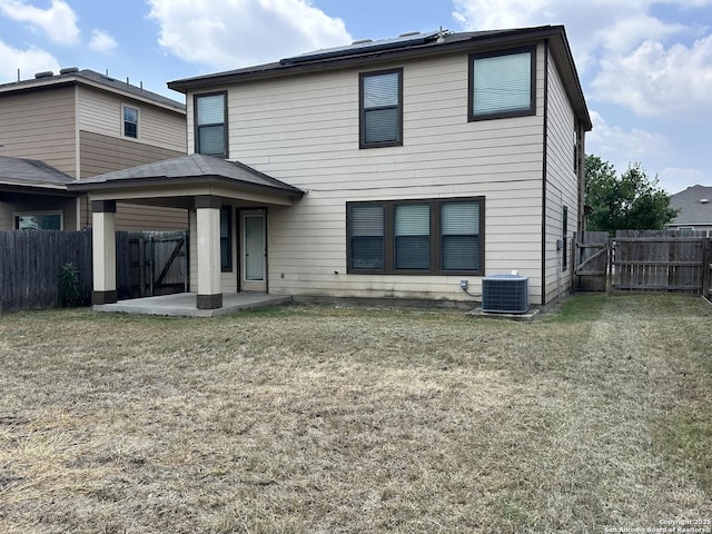 8815 Adhinger, San Antonio, TX 78245 - back of property featuring a gate, a patio, and central air condition unit