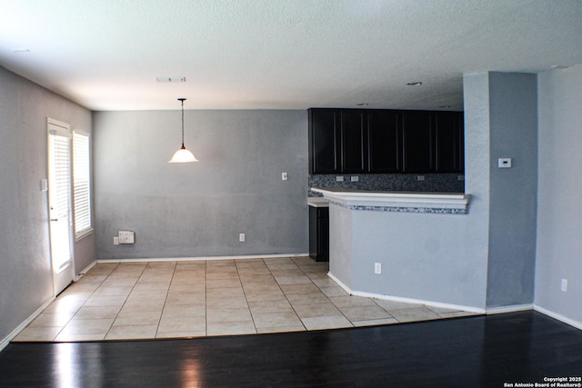 8815 Adhinger, San Antonio, TX 78245 - spare room with baseboards and a textured ceiling