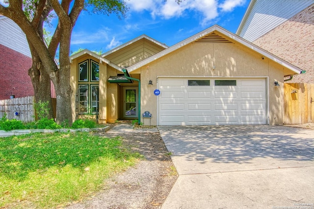 15018 Miss Ellie Dr, San Antonio, TX 78247 - view of front of home with a garage, driveway, and stucco siding