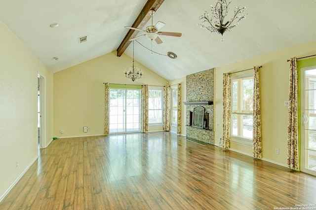 15018 Miss Ellie Dr, San Antonio, TX 78247 - unfurnished living room with wood-type flooring, ceiling fan, a chandelier, a fireplace, and baseboards