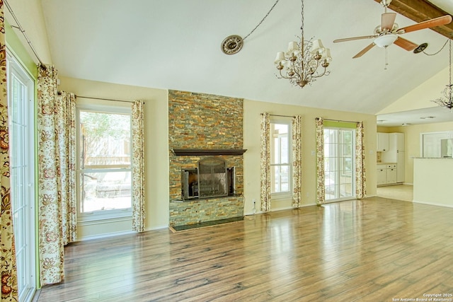 15018 Miss Ellie Dr, San Antonio, TX 78247 - unfurnished living room with wood finished floors, a chandelier, a fireplace, a ceiling fan, and high vaulted ceiling