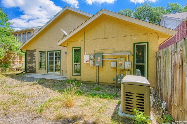 15018 Miss Ellie Dr, San Antonio, TX 78247 - back of house featuring stucco siding