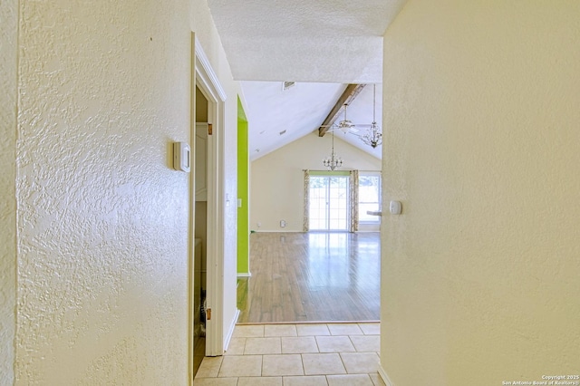 15018 Miss Ellie Dr, San Antonio, TX 78247 - hall featuring a textured wall, tile patterned floors, and baseboards