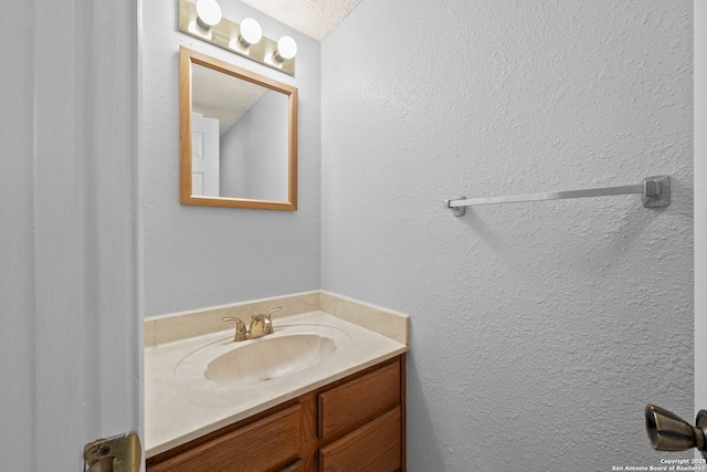 9387 Village Lance, San Antonio, TX 78250 - bathroom with vanity and a textured wall
