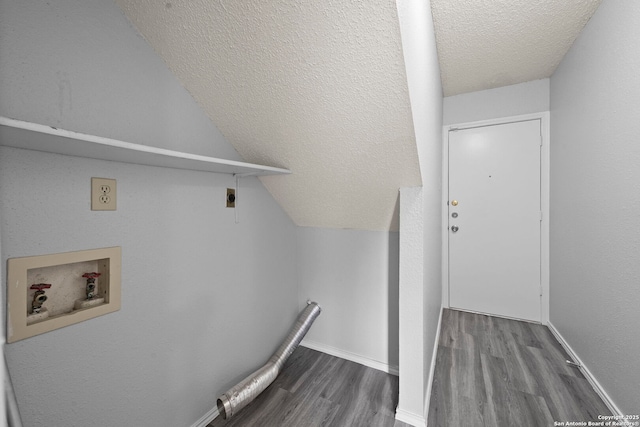 9387 Village Lance, San Antonio, TX 78250 - laundry room featuring a textured ceiling, hookup for a washing machine, wood finished floors, hookup for an electric dryer, and baseboards