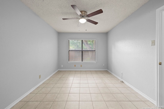 9387 Village Lance, San Antonio, TX 78250 - spare room featuring a textured ceiling, a ceiling fan, and baseboards