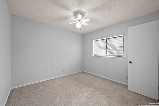 9387 Village Lance, San Antonio, TX 78250 - unfurnished room featuring ceiling fan, carpet, a textured ceiling, and baseboards