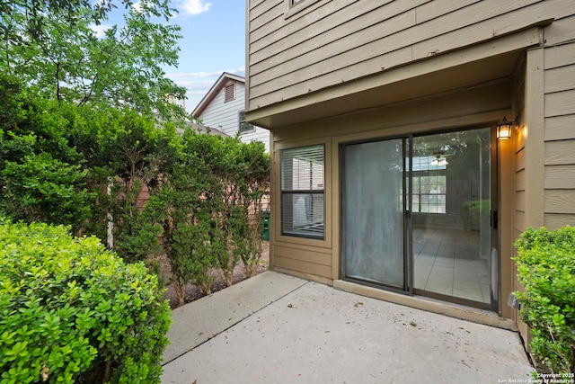 9387 Village Lance, San Antonio, TX 78250 - view of exterior entry with a patio