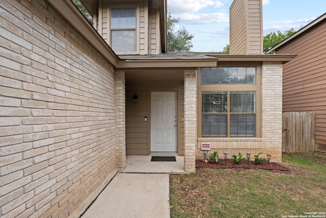 9387 Village Lance, San Antonio, TX 78250 - entrance to property featuring brick siding and a chimney