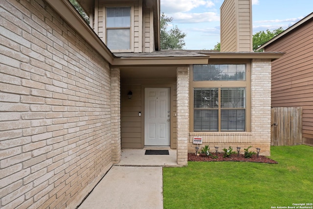 9387 Village Lance, San Antonio, TX 78250 - doorway to property featuring brick siding and a chimney