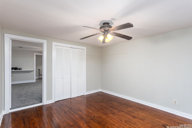 305 Kendalia, San Antonio, TX 78214 - unfurnished bedroom featuring a closet, baseboards, dark wood-type flooring, and ceiling fan