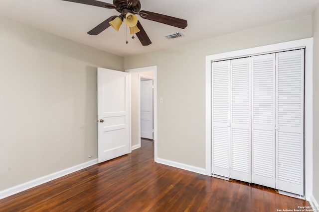 305 Kendalia, San Antonio, TX 78214 - unfurnished bedroom with dark wood finished floors, baseboards, a closet, and a ceiling fan