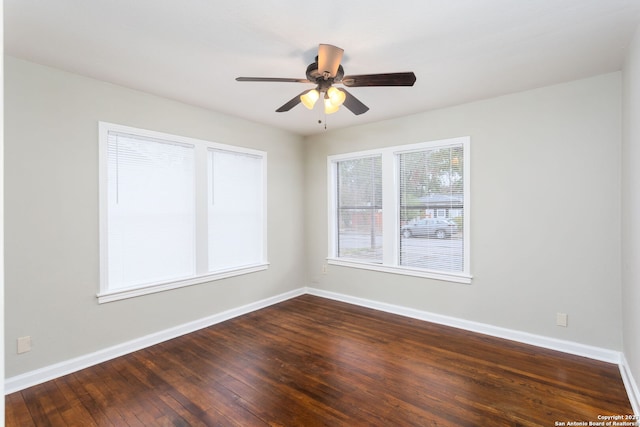 305 Kendalia, San Antonio, TX 78214 - spare room featuring dark wood finished floors, ceiling fan, and baseboards