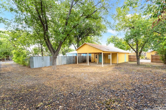 305 Kendalia, San Antonio, TX 78214 - back of house featuring a carport
