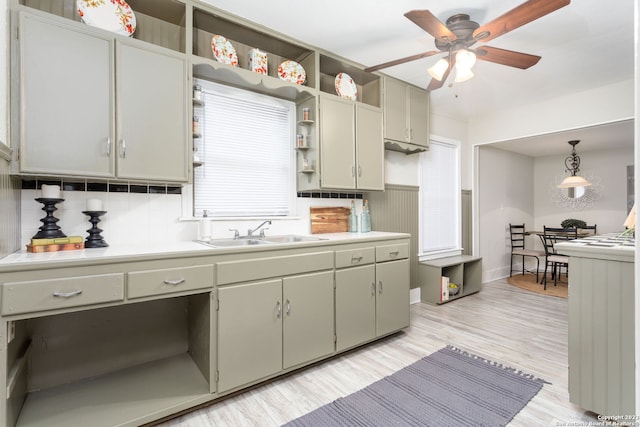305 Kendalia, San Antonio, TX 78214 - kitchen with a sink, open shelves, a ceiling fan, light countertops, and light wood-style flooring