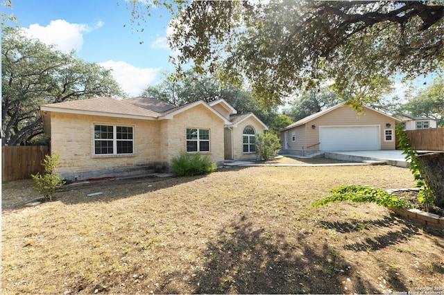 22919 Hightop, Elmendorf, TX 78112 - ranch-style house featuring stone siding, a garage, and an outbuilding
