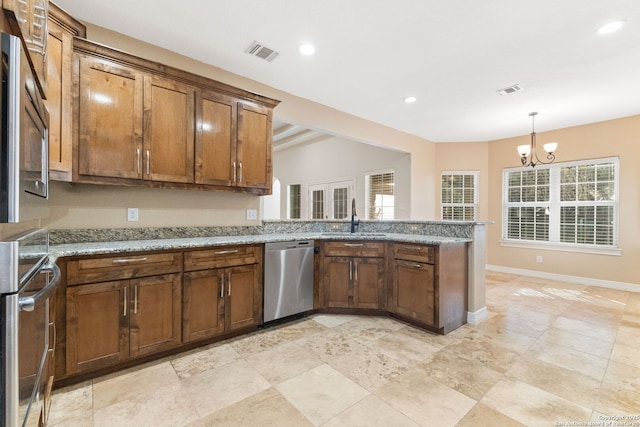 22919 Hightop, Elmendorf, TX 78112 - kitchen featuring stainless steel dishwasher, a sink, brown cabinets, a chandelier, and recessed lighting