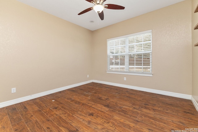 22919 Hightop, Elmendorf, TX 78112 - unfurnished room featuring ceiling fan, dark wood finished floors, and baseboards