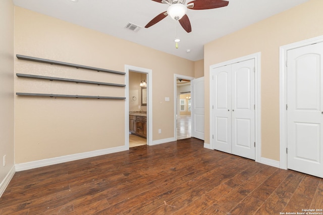 22919 Hightop, Elmendorf, TX 78112 - unfurnished bedroom with hardwood / wood-style floors, baseboards, and ensuite bath