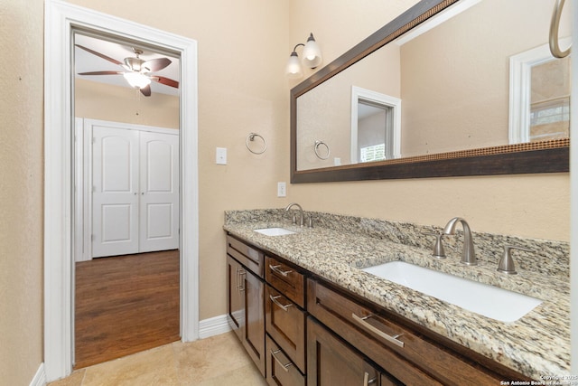 22919 Hightop, Elmendorf, TX 78112 - full bath featuring double vanity, a ceiling fan, tile patterned flooring, and baseboards